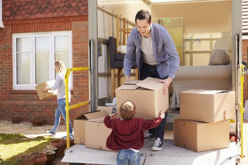 Professional packers handling boxes in Storage Chiswick