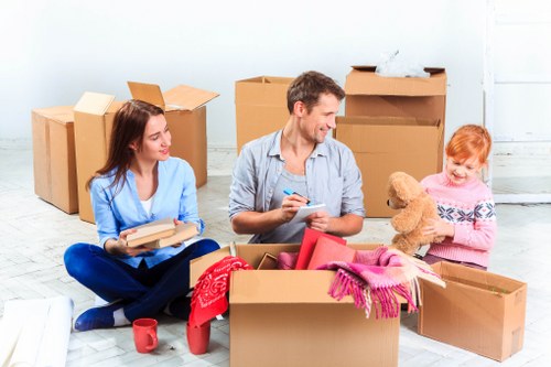 Professional movers handling office equipment in Storage Chiswick